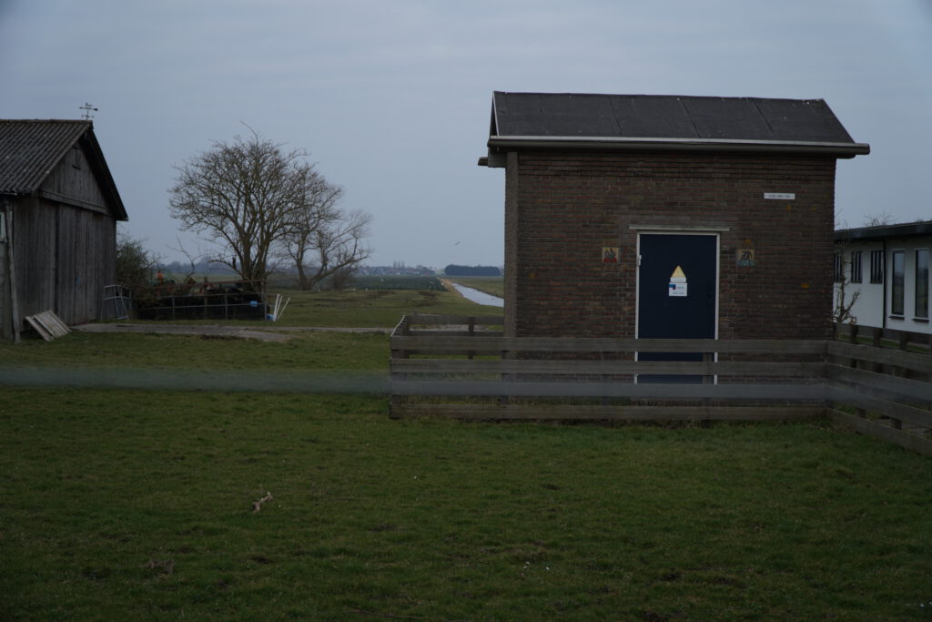 Small brick shed for electricity distribution in rural area.